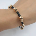 Leather bracelet with gold skulls (633) 2