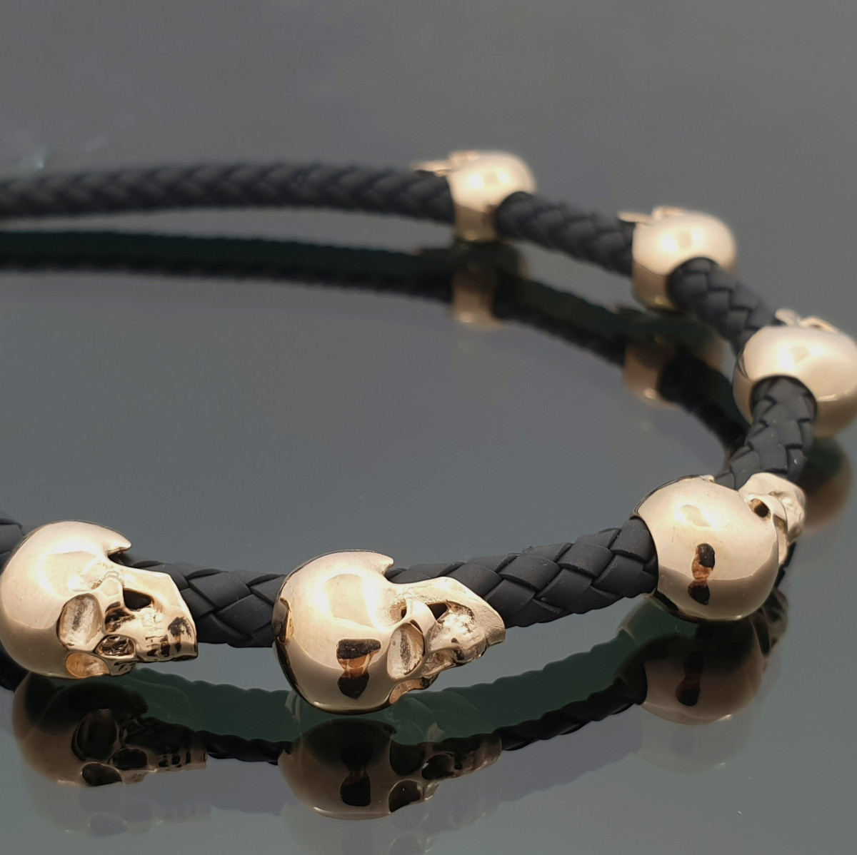 Leather bracelet with gold skulls (633) 1