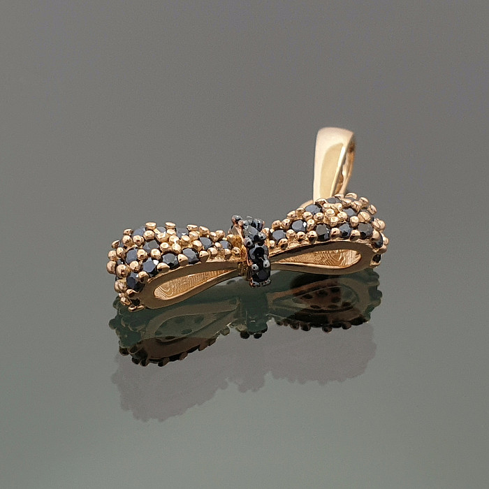 Gold pendant "Ribbon" with black eyes (1016)