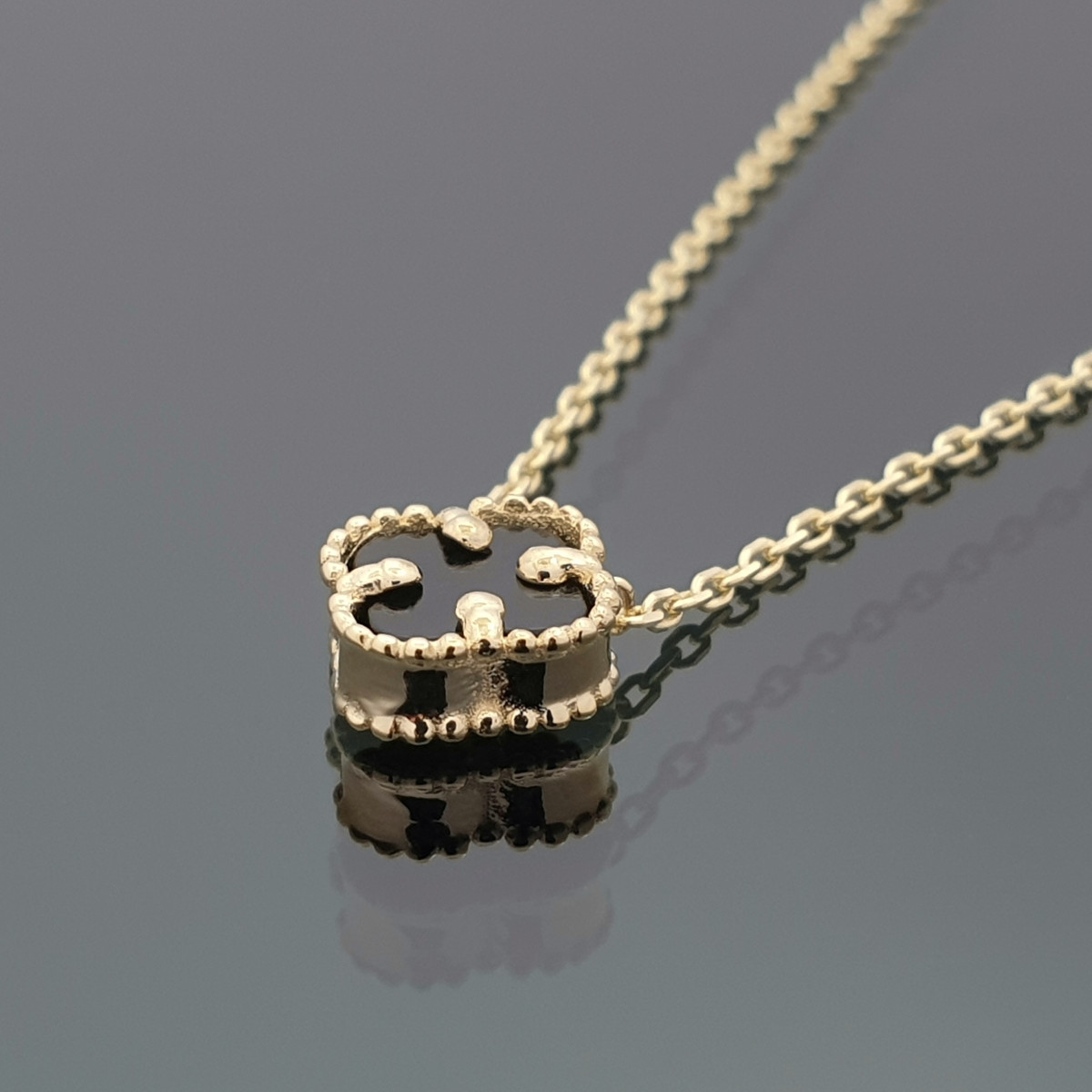 Yellow gold chain with black clover pendant (1619) 1