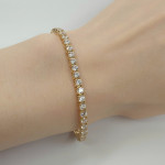 Dzeltenā zelta tenisa aproce (717), Cietas aproces, Zelta standarts: 750, Produkta foto svars: 13.15 g, Dārgakmeņi: Cirkons - Pielāgotas rotājumlietas