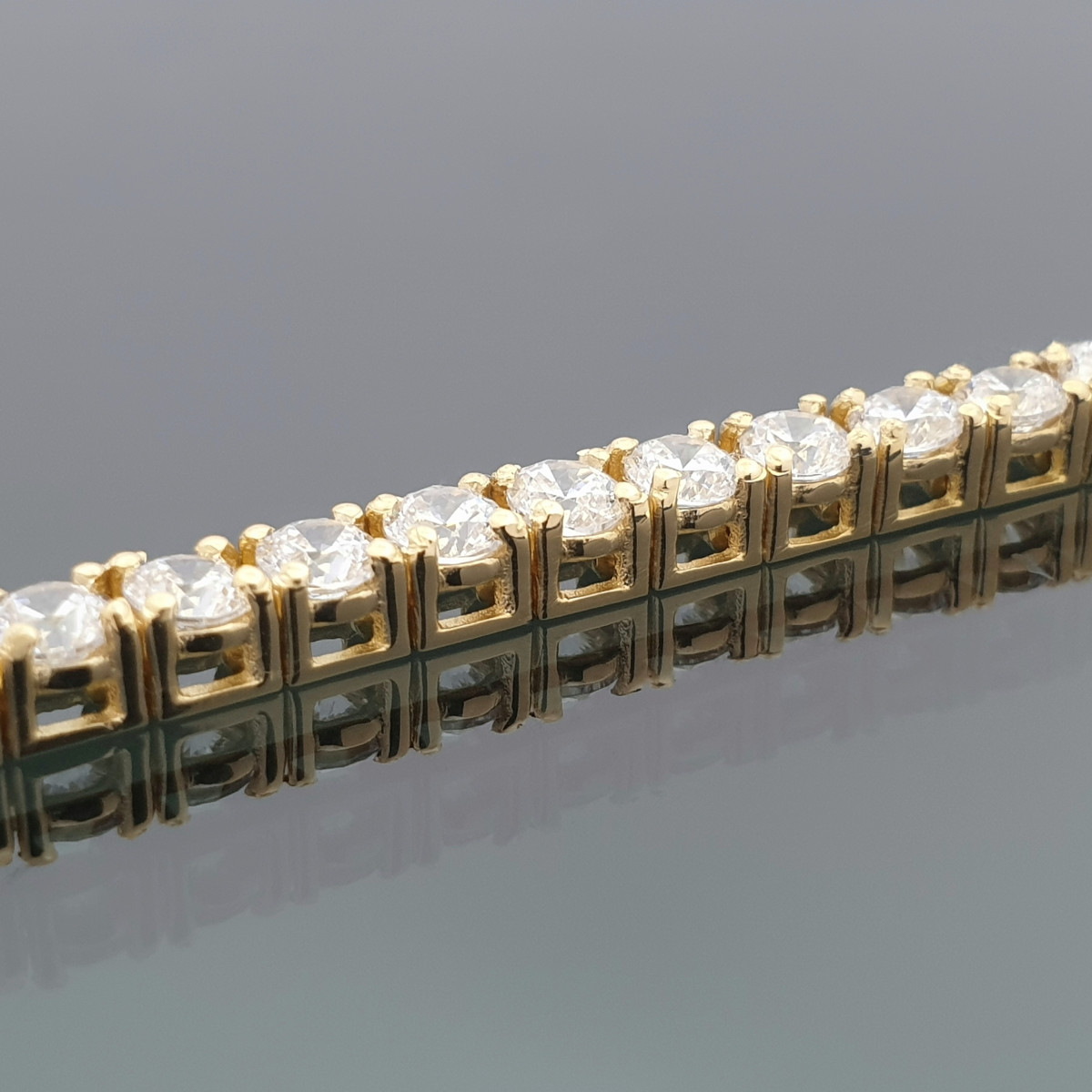 Dzeltenā zelta tenisa aproce (717), Cietas aproces, Zelta standarts: 750, Produkta foto svars: 13.15 g, Dārgakmeņi: Cirkons - Rotājumlietas internetā