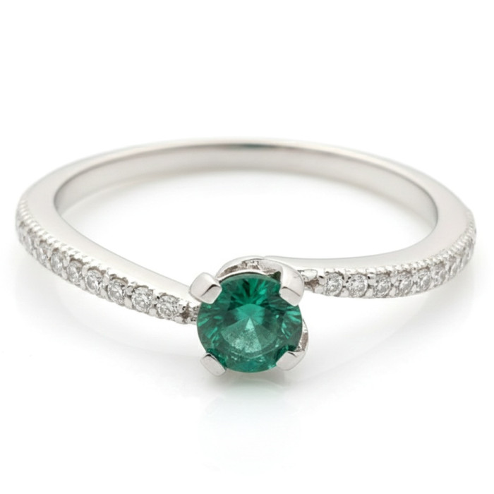 White gold ring decorated with emeralds and diamonds (1211)
